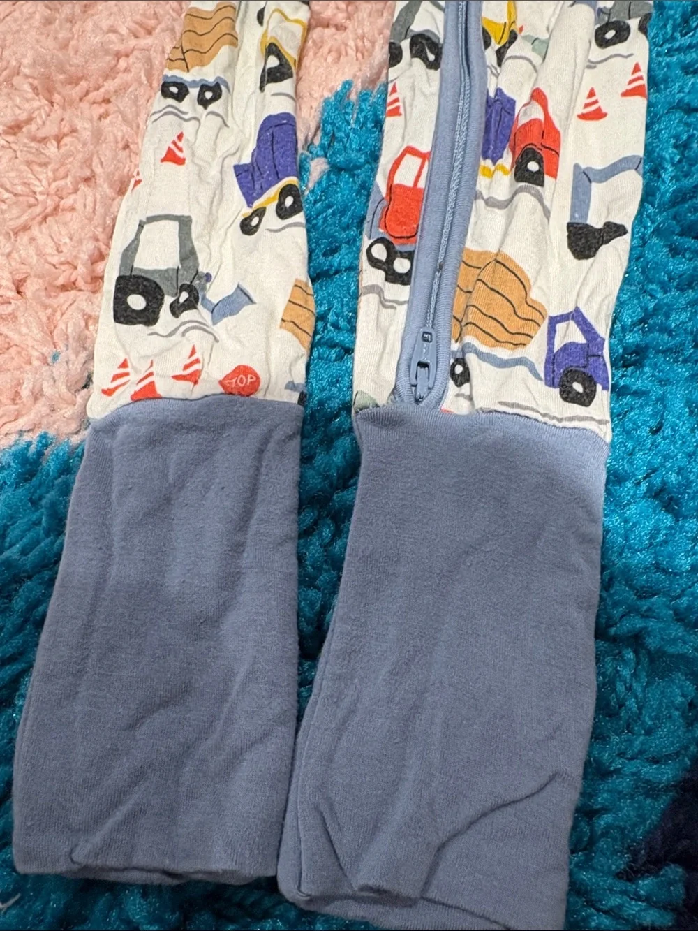 Little Sleepies White One-Piece Footie with Multicolor Truck Print and Blue Trim